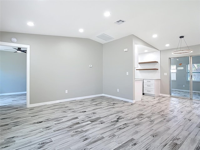 7140 Teaberry St, Englewood, FL 34224 - unfurnished living room featuring lofted ceiling, baseboards, light wood finished floors, recessed lighting, and ceiling fan