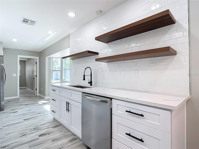 7140 Teaberry St, Englewood, FL 34224 - kitchen with appliances with stainless steel finishes, open shelves, a sink, baseboards, and recessed lighting