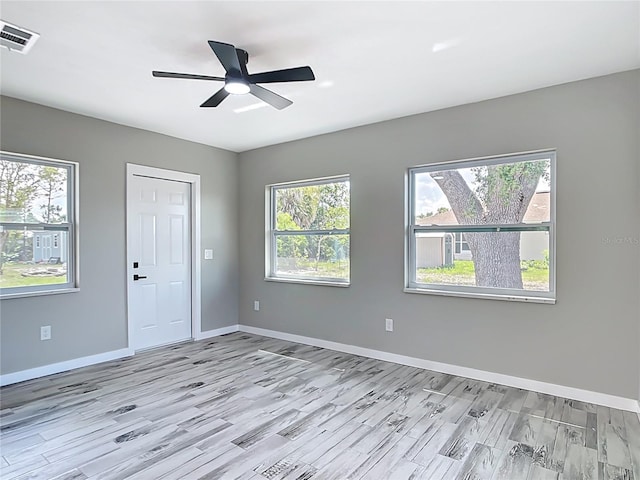 7140 Teaberry St, Englewood, FL 34224 - unfurnished room with light wood-style flooring, baseboards, and ceiling fan