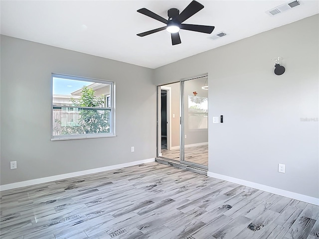 7140 Teaberry St, Englewood, FL 34224 - unfurnished room featuring light wood-style floors, baseboards, and a ceiling fan
