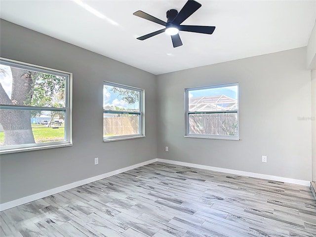 7140 Teaberry St, Englewood, FL 34224 - empty room featuring a ceiling fan, baseboards, and wood finished floors