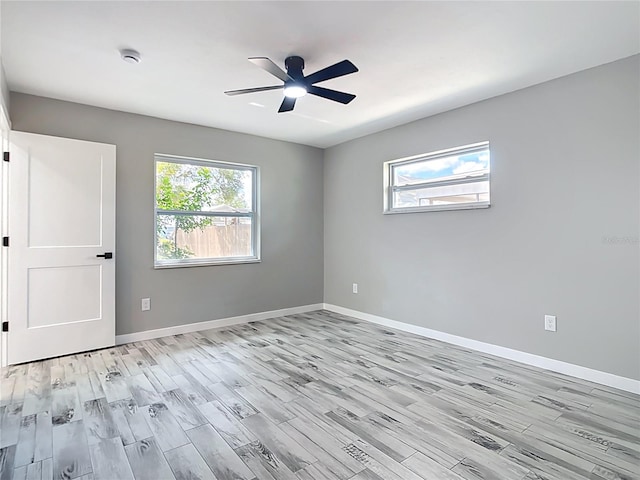 7140 Teaberry St, Englewood, FL 34224 - unfurnished room featuring light wood-style floors, ceiling fan, a smoke detector, and baseboards