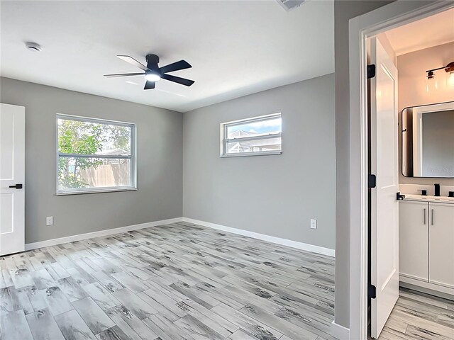 7140 Teaberry St, Englewood, FL 34224 - spare room with ceiling fan, light wood-style flooring, baseboards, and a smoke detector