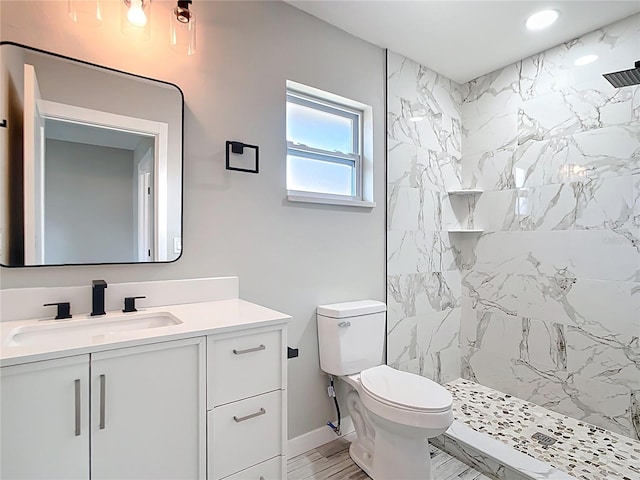 7140 Teaberry St, Englewood, FL 34224 - bathroom featuring vanity, a marble finish shower, toilet, recessed lighting, and baseboards