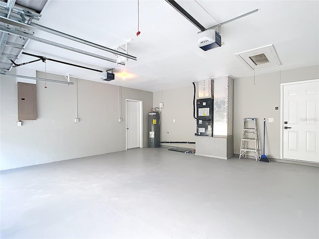 7140 Teaberry St, Englewood, FL 34224 - garage with water heater, electric panel, and a garage door opener