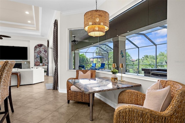 186 Portofino Dr, Nokomis, FL 34275 - dining space featuring a ceiling fan, a sunroom, baseboards, tile patterned flooring, and ornamental molding