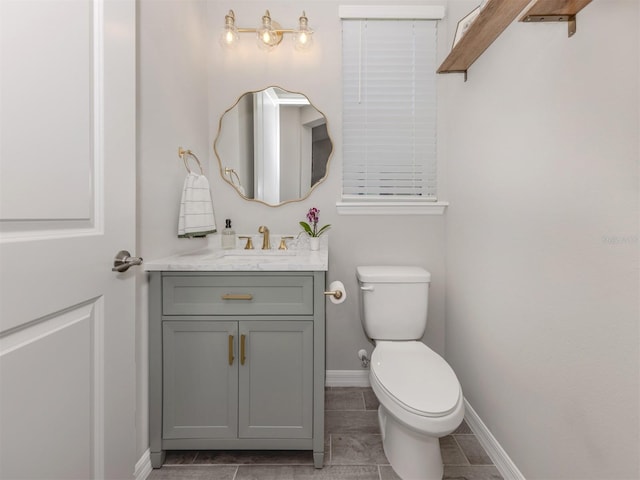 15364 Isla Palma Ln, Nokomis, FL 34275 - bathroom with vanity, baseboards, and toilet