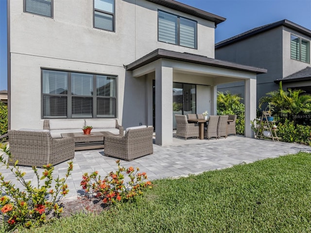 15364 Isla Palma Ln, Nokomis, FL 34275 - back of house with outdoor lounge area, a patio area, and stucco siding
