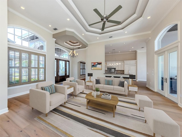 333 Sunrise Dr, Nokomis, FL 34275 - living area featuring light wood-style flooring, recessed lighting, a towering ceiling, baseboards, and french doors