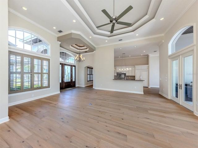 333 Sunrise Dr, Nokomis, FL 34275 - unfurnished living room featuring french doors, a chandelier, light wood-style flooring, recessed lighting, and ceiling fan