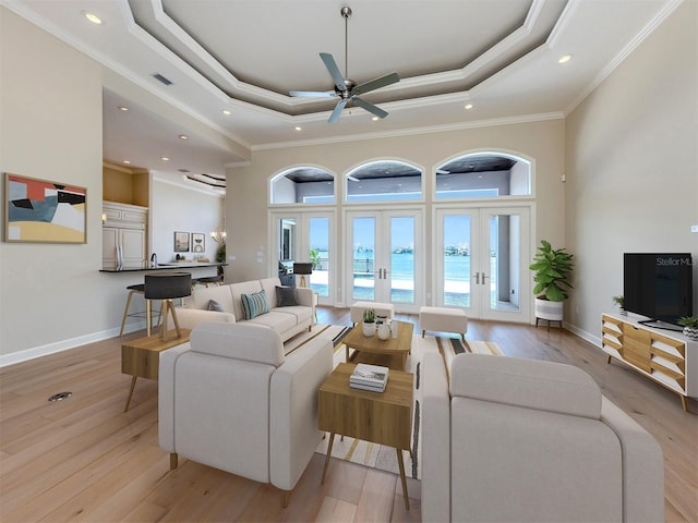 333 Sunrise Dr, Nokomis, FL 34275 - living area with a raised ceiling, a high ceiling, light wood finished floors, recessed lighting, and ornamental molding
