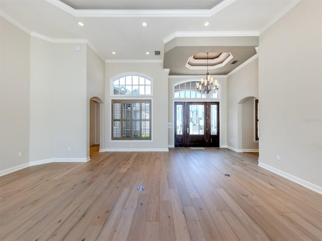 333 Sunrise Dr, Nokomis, FL 34275 - foyer featuring arched walkways, a chandelier, wood finished floors, recessed lighting, and baseboards
