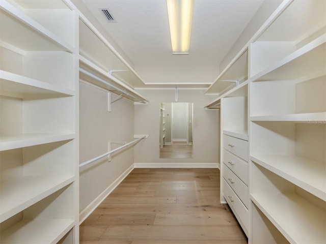 333 Sunrise Dr, Nokomis, FL 34275 - walk in closet with light wood-style flooring