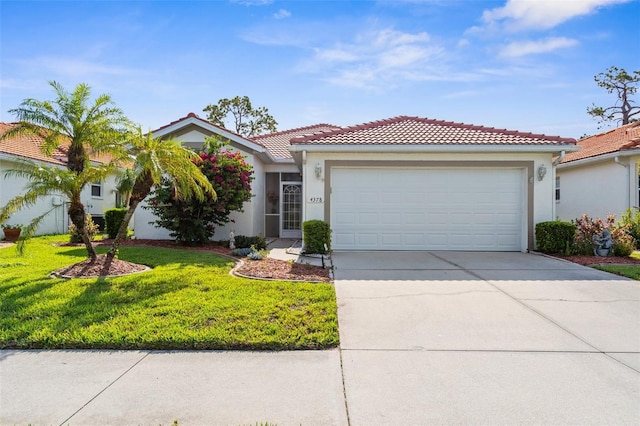 4378 Summertree Rd, Venice, FL 34293 - view of front of house featuring driveway, a garage, a front lawn, a tile roof, and stucco siding