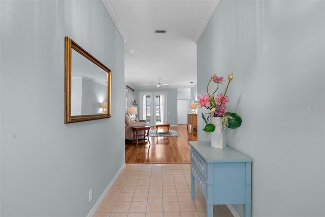4378 Summertree Rd, Venice, FL 34293 - hallway featuring baseboards, ornamental molding, light tile patterned flooring, and french doors