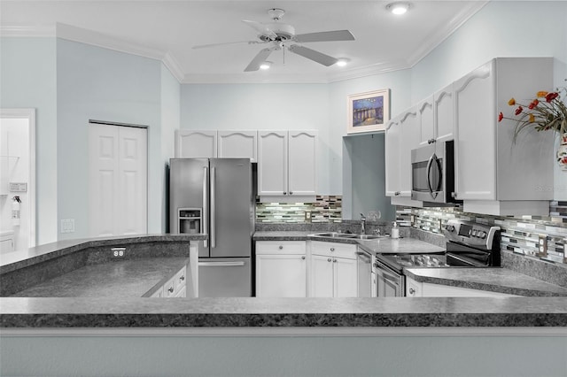 4378 Summertree Rd, Venice, FL 34293 - kitchen featuring appliances with stainless steel finishes, a sink, dark countertops, ornamental molding, and ceiling fan