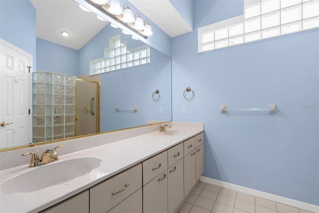 4378 Summertree Rd, Venice, FL 34293 - full bathroom featuring an enclosed shower, double vanity, tile patterned flooring, and baseboards