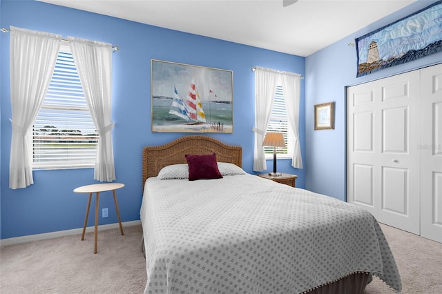 4378 Summertree Rd, Venice, FL 34293 - carpeted bedroom with a closet, baseboards, and ceiling fan