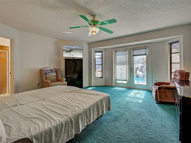 2194 Abalom St, Punta Gorda, FL 33980 - carpeted bedroom featuring access to outside, a textured ceiling, and ceiling fan