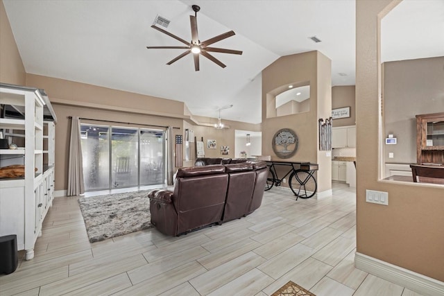 2769 Dode Ave, North Port, FL 34288 - living area featuring ceiling fan, wood tiled floors, high vaulted ceiling, and baseboards