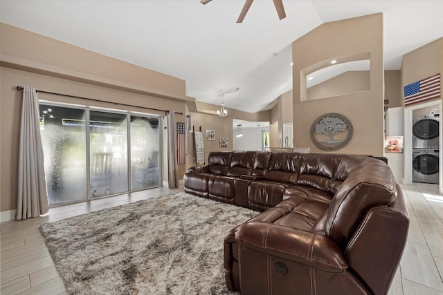 2769 Dode Ave, North Port, FL 34288 - living area featuring stacked washing machine and dryer, vaulted ceiling, and a ceiling fan