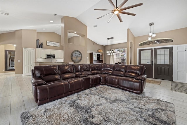 2769 Dode Ave, North Port, FL 34288 - living room with a ceiling fan, high vaulted ceiling, and arched walkways