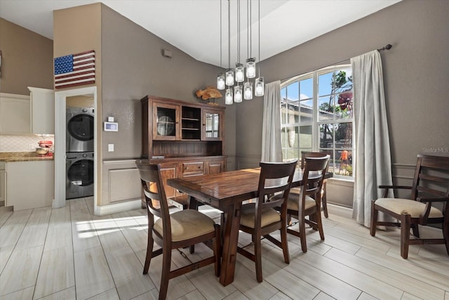 2769 Dode Ave, North Port, FL 34288 - dining space with stacked washer / drying machine and vaulted ceiling