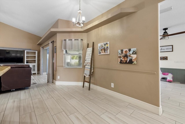 2769 Dode Ave, North Port, FL 34288 - entrance foyer featuring a chandelier, vaulted ceiling, ceiling fan, and baseboards