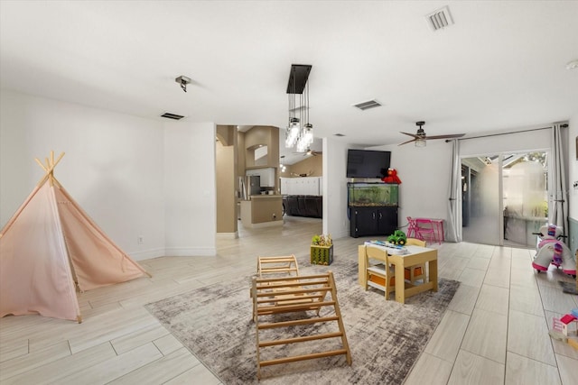 2769 Dode Ave, North Port, FL 34288 - living room with ceiling fan and baseboards