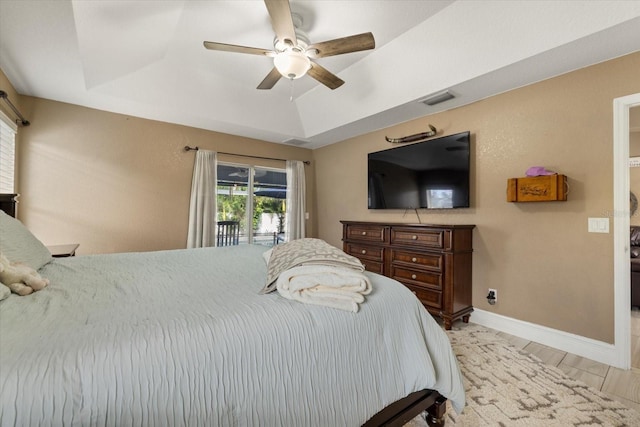 2769 Dode Ave, North Port, FL 34288 - bedroom featuring access to outside, ceiling fan, baseboards, and a tray ceiling