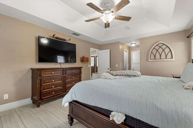 2769 Dode Ave, North Port, FL 34288 - bedroom featuring a tray ceiling, baseboards, and ceiling fan