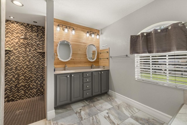 2769 Dode Ave, North Port, FL 34288 - bathroom with double vanity, baseboards, a tile shower, marble finish floors, and recessed lighting