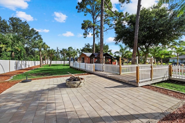 2769 Dode Ave, North Port, FL 34288 - view of patio featuring an outdoor fire pit and a deck