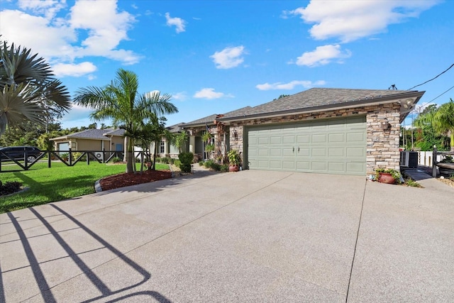 2769 Dode Ave, North Port, FL 34288 - ranch-style home featuring driveway, stone siding, and an attached garage