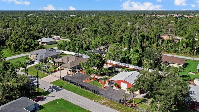 2769 Dode Ave, North Port, FL 34288 - aerial perspective of suburban area featuring a heavily wooded area
