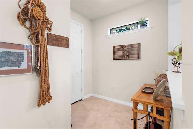 13486 Nobilio St, Venice, FL 34293 - entryway with baseboards and light tile patterned flooring