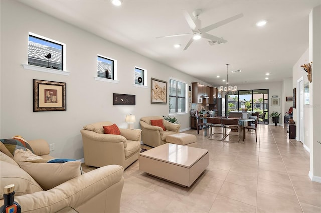 13486 Nobilio St, Venice, FL 34293 - living area featuring recessed lighting, a ceiling fan, a chandelier, and light tile patterned floors