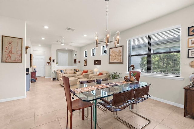 13486 Nobilio St, Venice, FL 34293 - dining area with recessed lighting, light tile patterned floors, ceiling fan, and a chandelier