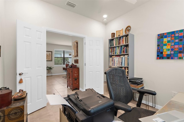 13486 Nobilio St, Venice, FL 34293 - home office with light tile patterned floors and baseboards