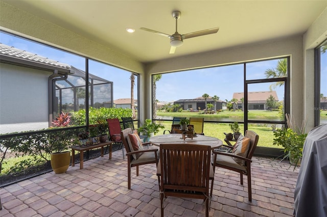 13486 Nobilio St, Venice, FL 34293 - sunroom with ceiling fan, brick flooring, outdoor dining area, a residential view, and recessed lighting
