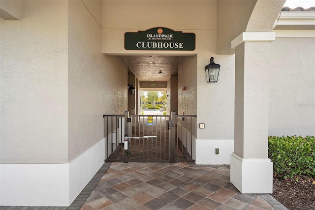 13486 Nobilio St, Venice, FL 34293 - doorway to property with stucco siding