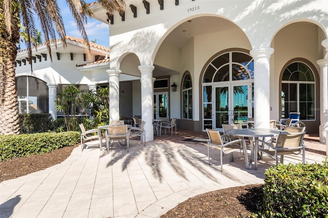 13486 Nobilio St, Venice, FL 34293 - view of patio / terrace with french doors and outdoor dining area
