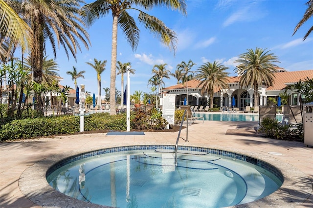 13486 Nobilio St, Venice, FL 34293 - community pool with a community hot tub and a patio
