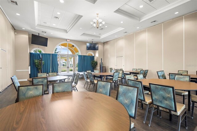 13486 Nobilio St, Venice, FL 34293 - dining room featuring a high ceiling, wood finished floors, a chandelier, crown molding, and recessed lighting