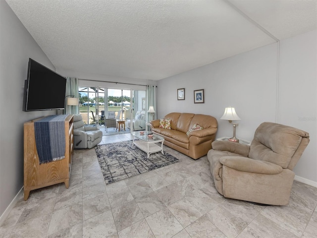 418 Cerromar Ct Unit 158, Venice, FL 34293 - living room with a textured ceiling and baseboards