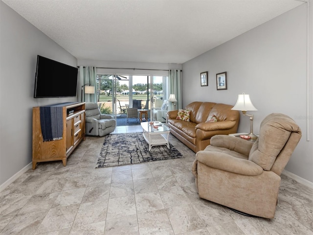 418 Cerromar Ct Unit 158, Venice, FL 34293 - living room featuring baseboards