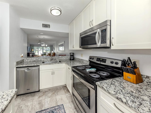 418 Cerromar Ct Unit 158, Venice, FL 34293 - kitchen featuring appliances with stainless steel finishes, a sink, and white cabinets