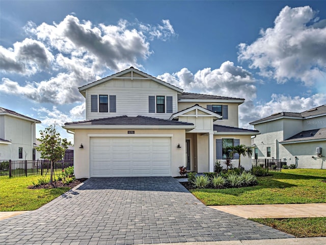 12705 Pinnacle Ln, Venice, FL 34293 - traditional-style home featuring decorative driveway, an attached garage, and stucco siding