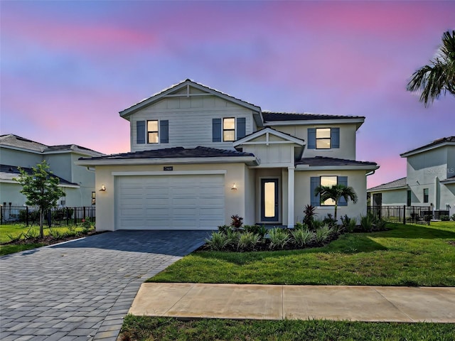 12705 Pinnacle Ln, Venice, FL 34293 - traditional home featuring decorative driveway, an attached garage, and stucco siding