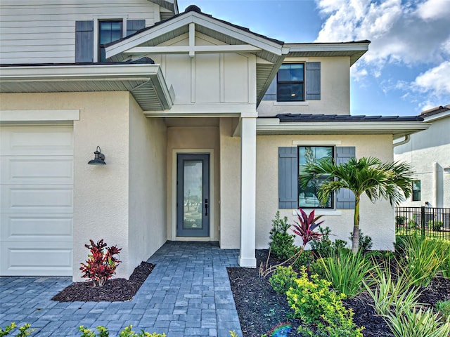12705 Pinnacle Ln, Venice, FL 34293 - doorway to property with stucco siding and board and batten siding